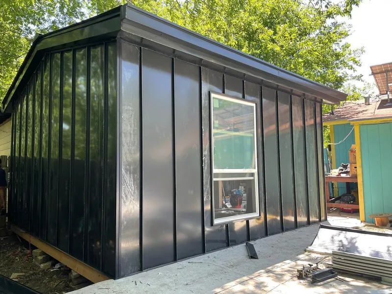 Black standing seam metal wall panels for Roof Inspection in Littleton