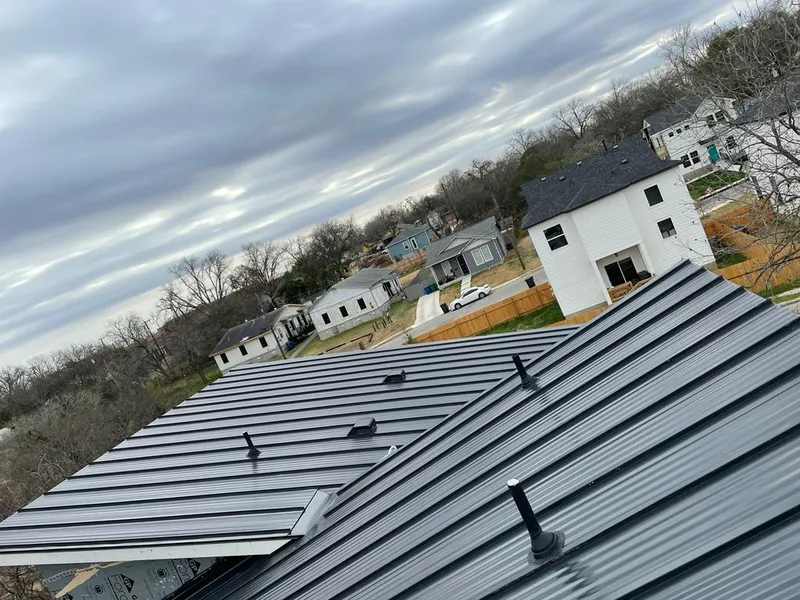 Standing seam metal roof panels with vents for Skylight Repair in Littleton